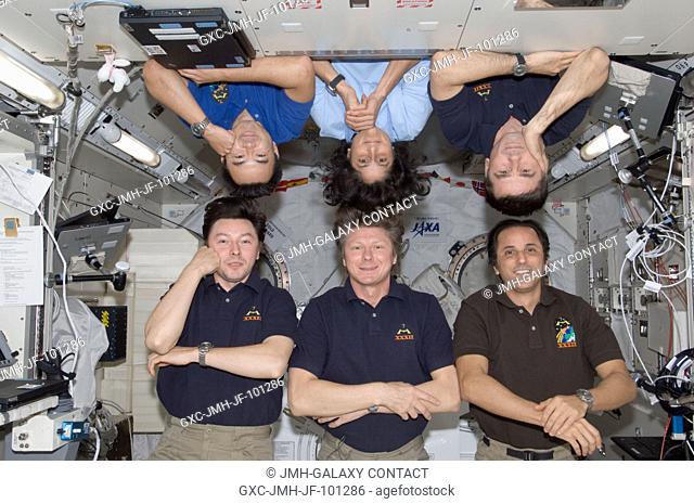 Expedition 32 crew members pose for a photo in the Kibo laboratory of the International Space Station. Pictured on the bottom row are Russian cosmonaut Gennady...