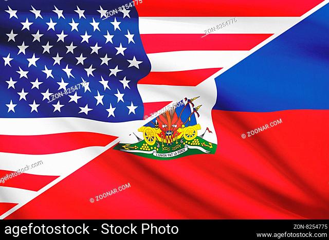 Flags of USA and Republic of Haiti blowing in the wind. Part of a series