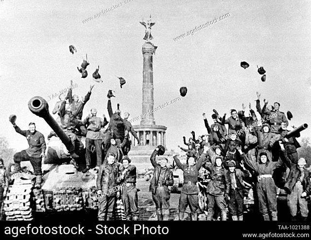Berlin, Germany. Soviet tankers celebrate the unconditional surrender of Nazi Germany in the Second World War at the Victory Column in the Tiergarten Park