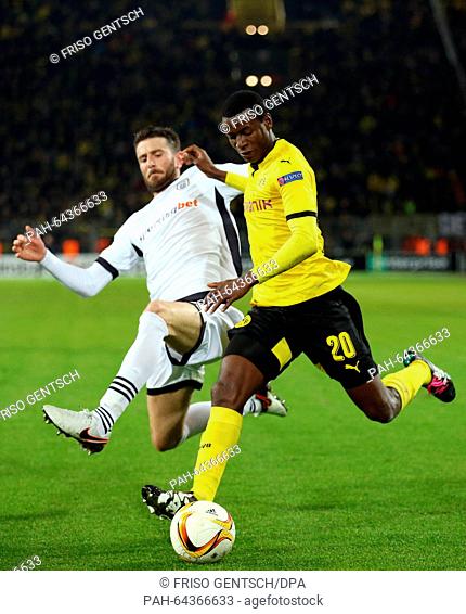 Dortmund's Adrian Ramos and Saloniki's Stelios Malezas (L) in action during the Europa League group C soccer match Borussia Dortmund vs PAOK Saloniki in...
