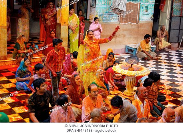 Devotees celebrating Rangpanchmi at Gangshyamji  temple ; Jodhpur ; Rajasthan ; India