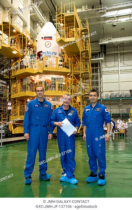 In the Integration Facility at the Baikonur Cosmodrome in Kazakhstan, Expedition 3839 Flight Engineer Rick Mastracchio of NASA (left)