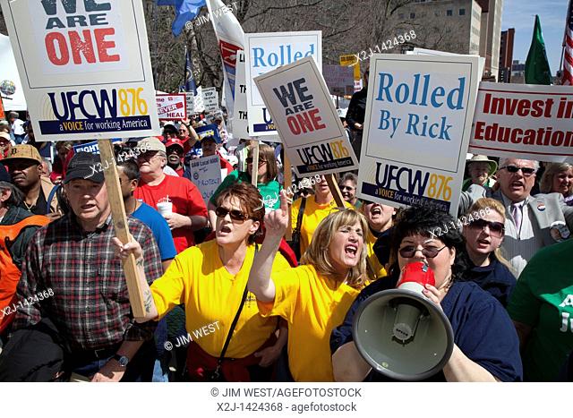 Lansing, Michigan - Thousands of Michigan union members rallied at the state capitol building to protest Michigan Governor Rick Snyder's proposed state budget