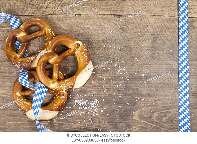 Oktoberfest pretzel on wooden table (copy space)