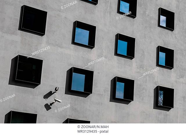 windows on building exterior, security cameras