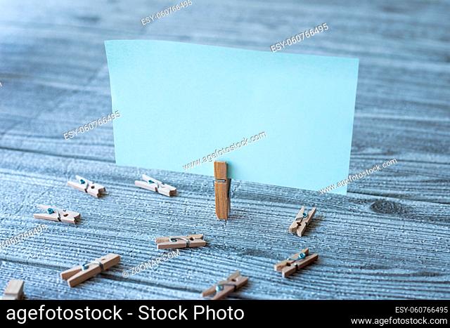 Piece Of Blank Square Note Surrounded By Laundry Clips Showing New Idea