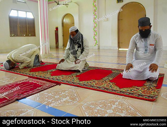 In the outskirts of Agartala, capital of the Northeastern state of Tripura, India, muslim devotes read the Quran at a Mosque