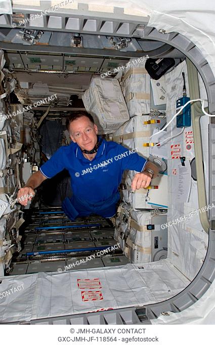 This image shows NASA astronaut Chris Ferguson, STS-135 commander, in the Raffaello multi-purpose logistics module. The photo serves as the after shot following...