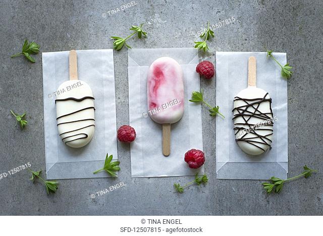 Three white chocolate ice cream sticks