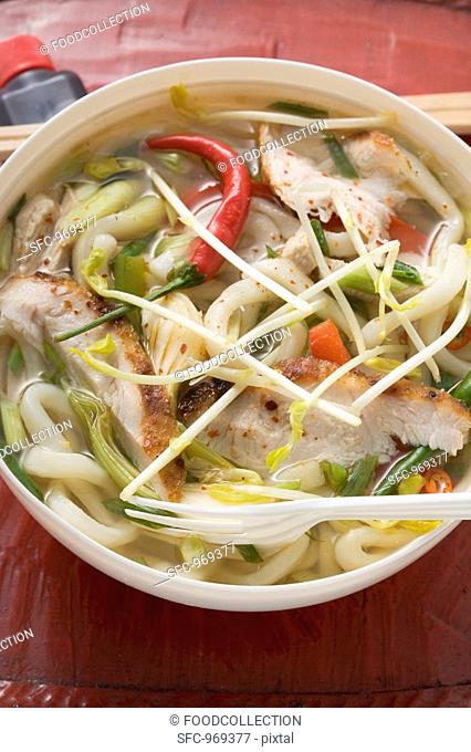 Spicy noodle soup with chicken to take away Asia