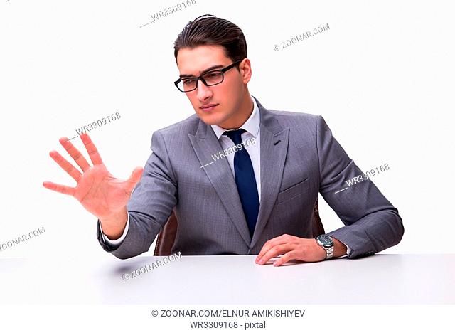 Young businessman pressing virtual buttons isolated on white background
