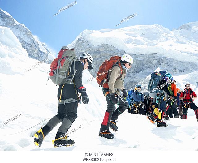 Hikers backpacking on mountain, Everest, Khumbu region, Nepal