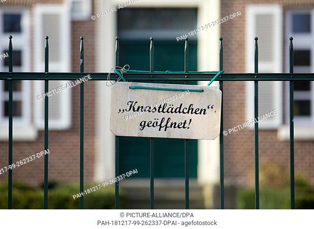 14 December 2018, Lower Saxony, Lingen: A sign with the inscription ""Jailhouse open"" hangs on a fence. The Lingen correctional facility (JVA) sells items from...