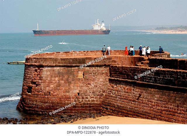 Tourists enjoying the views from the Fort Aguada in North Goa ; India