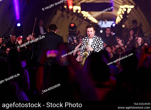 RUSSIA, MOSCOW - JULY 8, 2023: Saxophonist Taras Gusarov performs with the Imperialis Orchestra during a concert at the Arbatskaya station of the Moscow Metro...