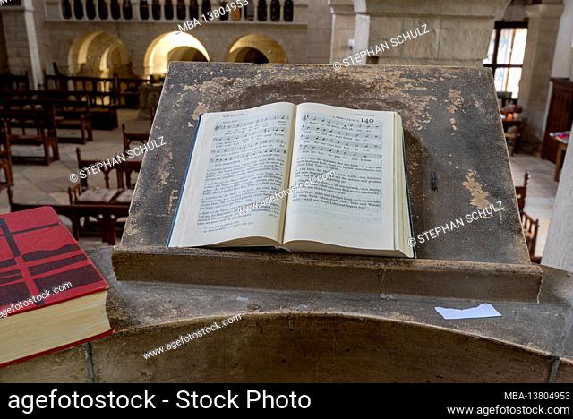 Germany, Saxony-Anhalt, Gernrode, hymn book lies on the pulpit of the collegiate church St. Cyriakus, is one of the most important Ottonian architectural...