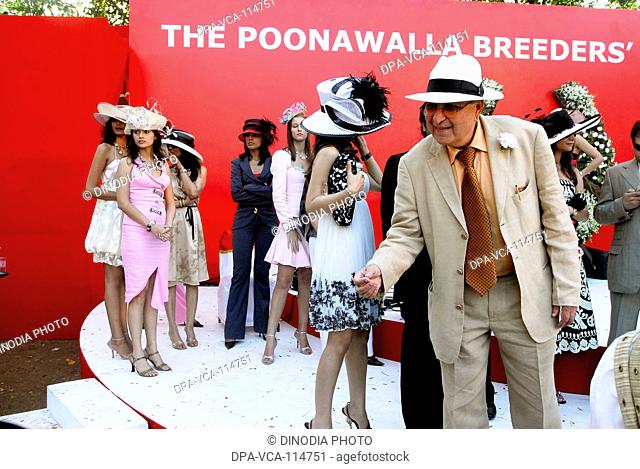 South Asian Poonawala breeders with fashion models at mahalaxmi racecourse ; Bombay  Mumbai  ;  Maharashtra ; India