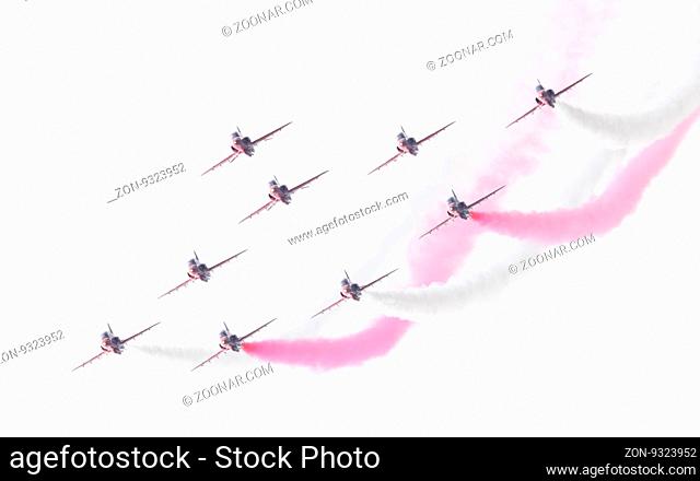 LEEUWARDEN, THE NETHERLANDS - JUNE 10, 2016: RAF Red Arrows performing at the Dutch Air Force Open House on June 10, 2016 at Leeuwarden Airfield