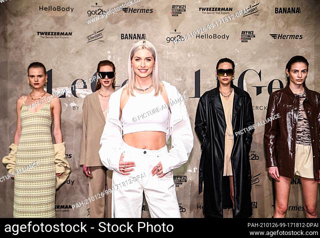 24 January 2021, Berlin: Lena Gercke (front) and models show creations by LeGer by Lena Gercke at About You Fashion Week at Kraftwerk Berlin