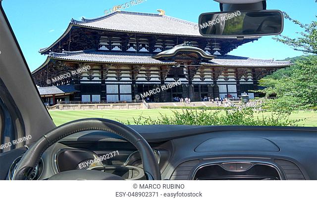 Looking through a car windshield with view of Todai-ji Buddhist Temple, Nara, Japan