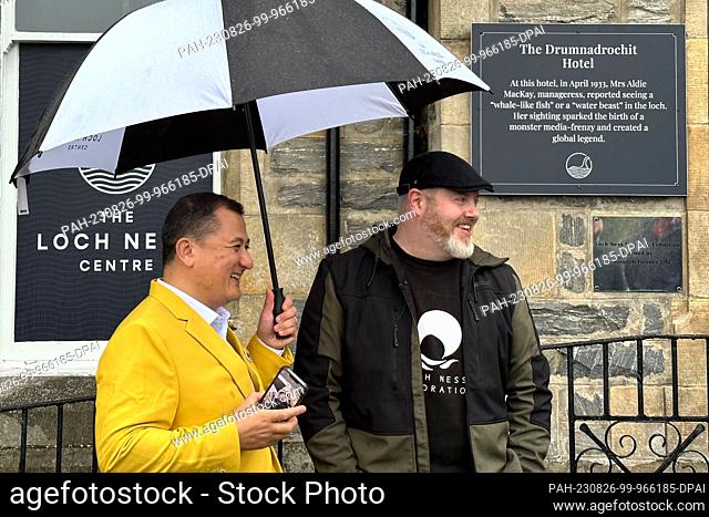 26 August 2023, Great Britain, Drumnadrochit: Paul Nixon (l) of the Loch Ness Centre and project manager Alan McKenna stand outside the Loch Ness Centre tourist...
