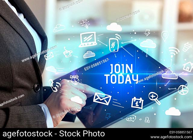 Close-up Of A Person Using Social Networking with JOIN TODAY inscription