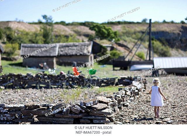 A little girl in an old fishing port Sweden