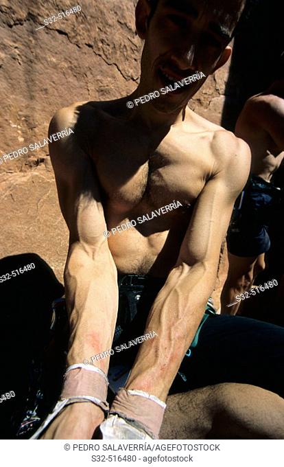 Roberto Largo showing his wounded arms after climbing 'Supercrack' (5.10). Indian Creek. Utah. USA