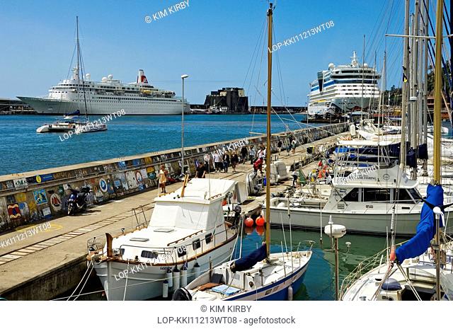 Portugal, Madeira, Funchal. Boats and cruise ships dock in Funchal marina and harbour