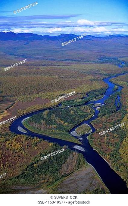 RUSSIA, KAMCHATKA, VIEW OF FOREST AND RIVER BETWEEN AVACHA AND ZHUPANOVSKY VOLCANOES