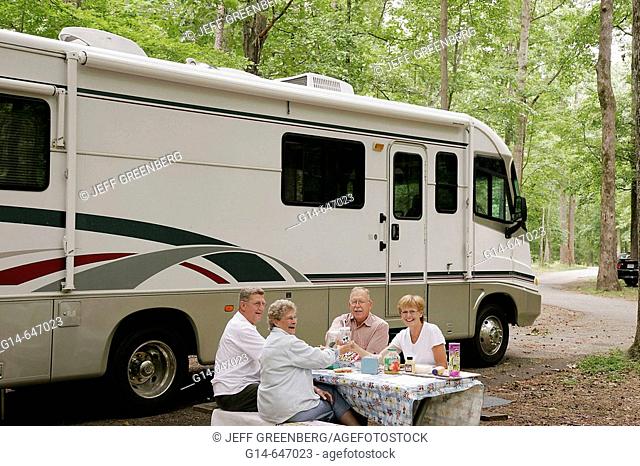Newport News Park, Campground, active senior, couple, man, woman, picnic table, RV, recreational vehicle. Virginia. USA