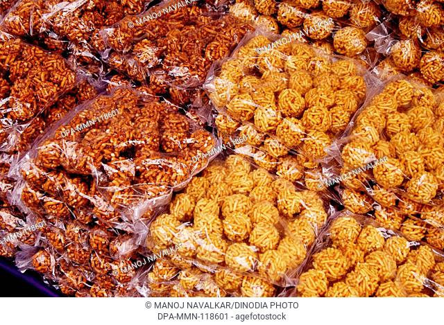 Kadkade Ladu Malwani sweet for sale in market at Malwan ; Dist Sindhudurg ; Maharashtra ; India