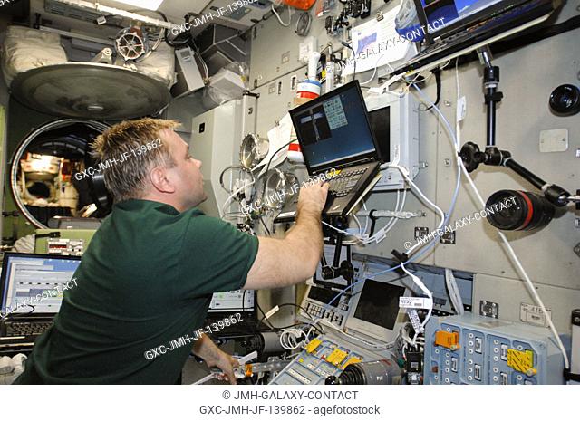 Russian cosmonaut Maxim Suraev, Expedition 40 flight engineer, practices manual docking techniques with the TORU, or telerobotically operated rendezvous system