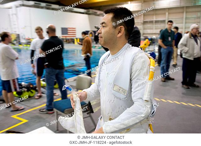 Japan Aerospace Exploration Agency (JAXA) astronaut Akihiko Hoshide, Expedition 3233 flight engineer, prepares for a spacewalk training session in the waters of...