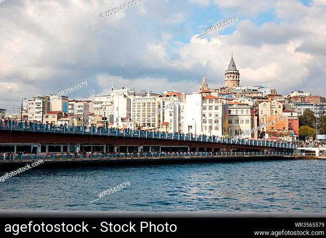 View of the Galata Bridge with fishermen and tourists. Istanbul, Turkey