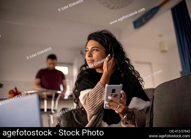 Beautiful woman using smart phone at home