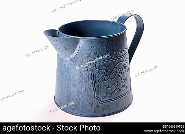 iron jug for watering flowers on white background