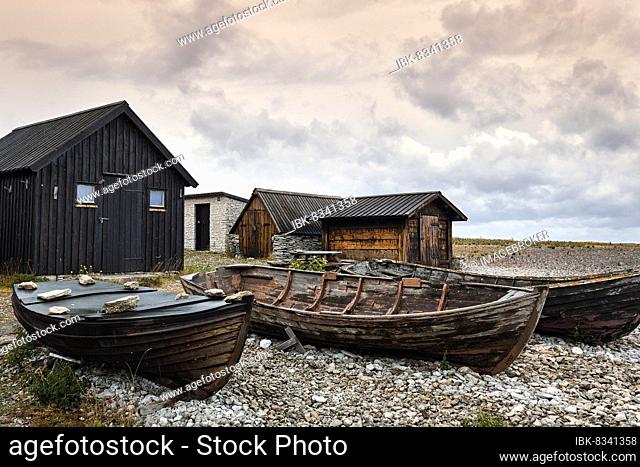 Old fishermen's huts and boats, traditional fishing place, fishing village, Helgumannen Fiskeläge, cloudy sky, Fårö Island, Farö, Gotland, Baltic Sea, Sweden