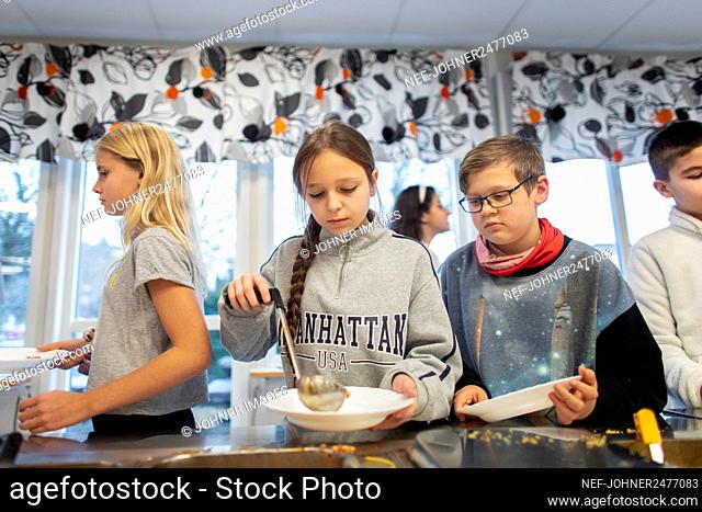 Children choosing food in school canteen