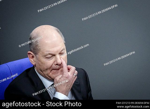 13 December 2023, Berlin: Federal Chancellor Olaf Scholz (SPD) attends the session after his government statement in the Bundestag