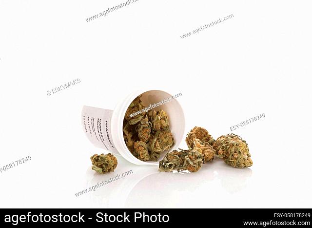 Cannabis in prescription bottle isolated on white background. Alternative medicine