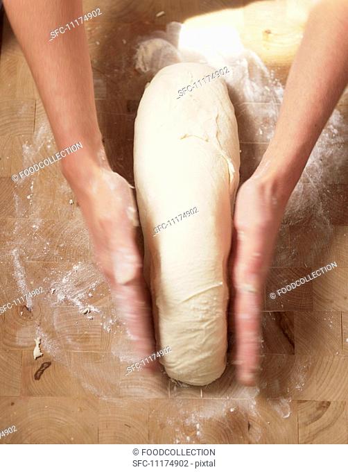 Kneading and Forming Bread Dough on a Floured Surface