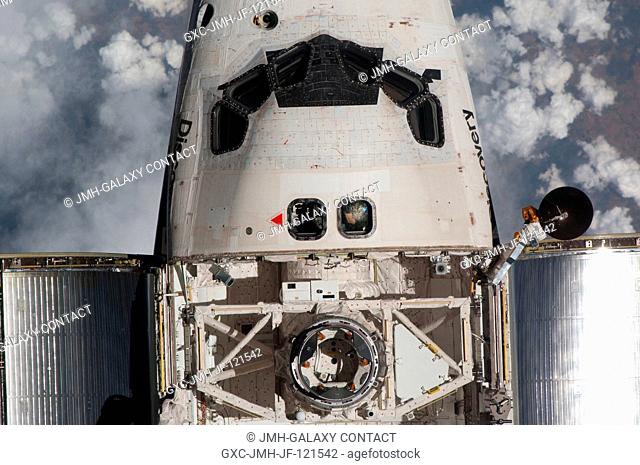 This view of the crew cabin and part of the cargo bay of the space shuttle Discovery was provided by an Expedition 23 crew member during a survey of the...