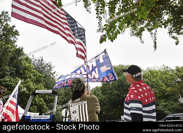 Trump supporters gather outside Fulton County Jail in Atlanta, Georgia where he is expected to surrender at the jail this afternoon and will have his mug shot...
