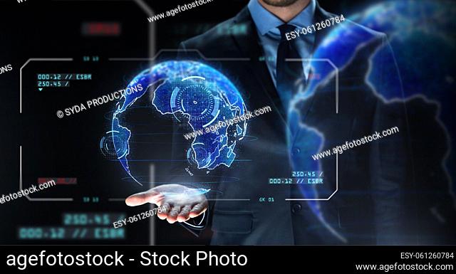 businessman with virtual earth projection