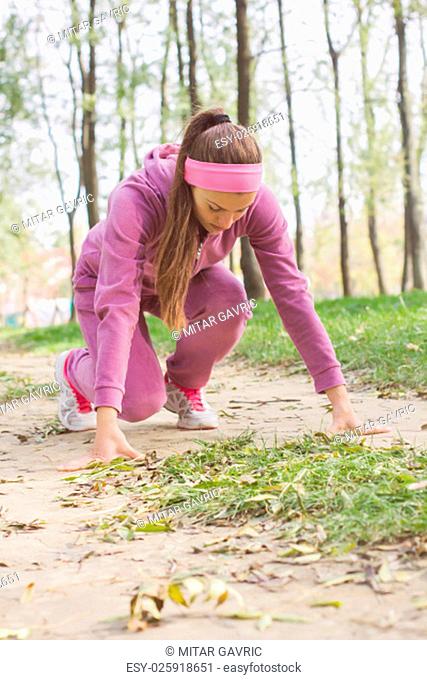 Fitness Woman Running , female athlete, position ready for run, healthy lifestyle outdoor