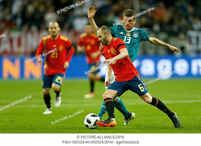 Soccer: Friendly match, Germany vs Spain, 23 March 2018 in the ESPRIT arena, Duesseldorf, Germany: Germany's Thomas Mueller (R) and Spain's Andres Iniesta vying...