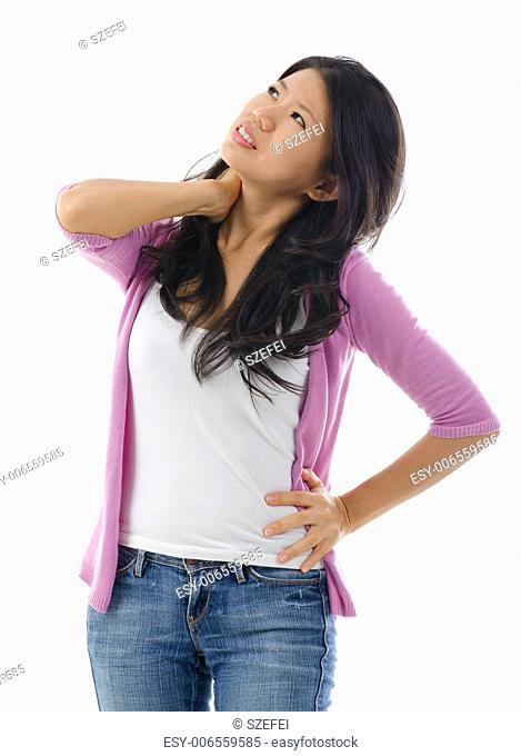 Tired Asian woman having neck and shoulder pain, standing isolated over white background