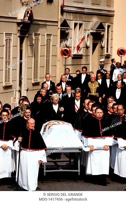 The funeral procession following the coffin of Princess Grace. Ranieri III next to his sons Caroline and Albert in the funeral procession follow the coffin of...