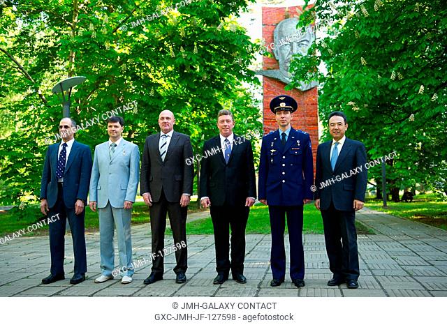 The prime and backup crew members for Expedition 28 to the International Space Station pose for pictures on the grounds of the Gagarin Cosmonaut Training Center